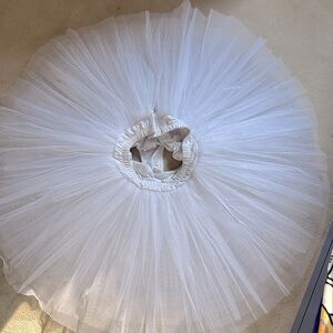 White ballet tutu with underwear with adjustable hooks for waist.